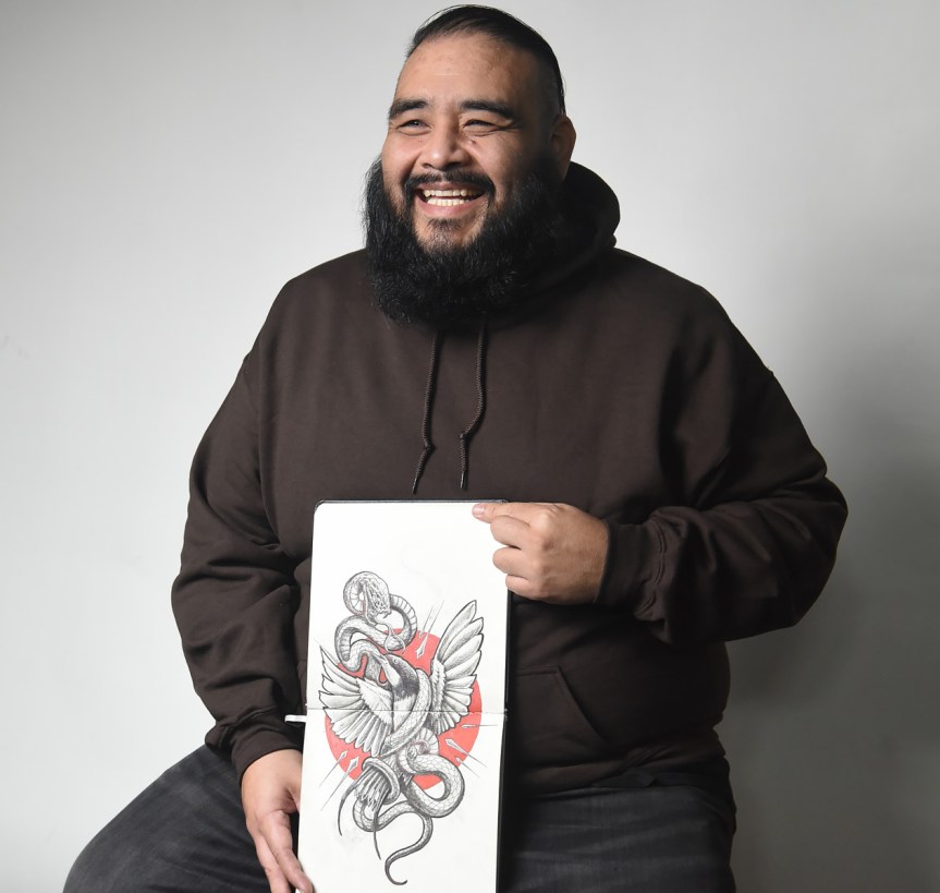 Image of a man holding a drawing